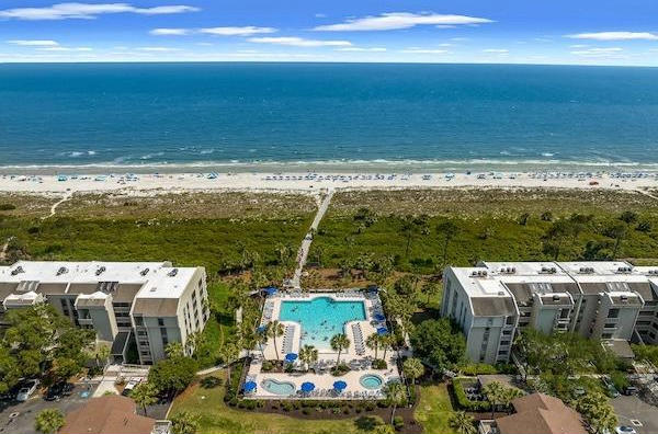Aerial view of Forest Beach neighborhood with vacation rentals and beach access on Hilton Head Island